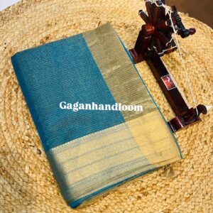 Maheshwari Handloom Tissue Saree with Duble Jari Border The Maheshwari Handloom Tissue Saree is a true symbol of sophistication and royal charm. Handwoven with a unique blend of silk yarns and metallic tissue threads, this saree reflects a subtle sheen that makes it stand apart. Its highlight is the exquisite Diamond Zari Border, meticulously woven with Surat’s fine tested zari, adding grandeur to the soft shimmer of tissue fabric. The saree drapes gracefully, offering a rich yet lightweight feel – making it a favorite for brides, festive wear, and timeless heirloom collections. Crafted in the heritage town of Maheshwar, every saree carries the authenticity of 300 years of weaving tradition initiated by Rajmata Ahilyabai Holkar.