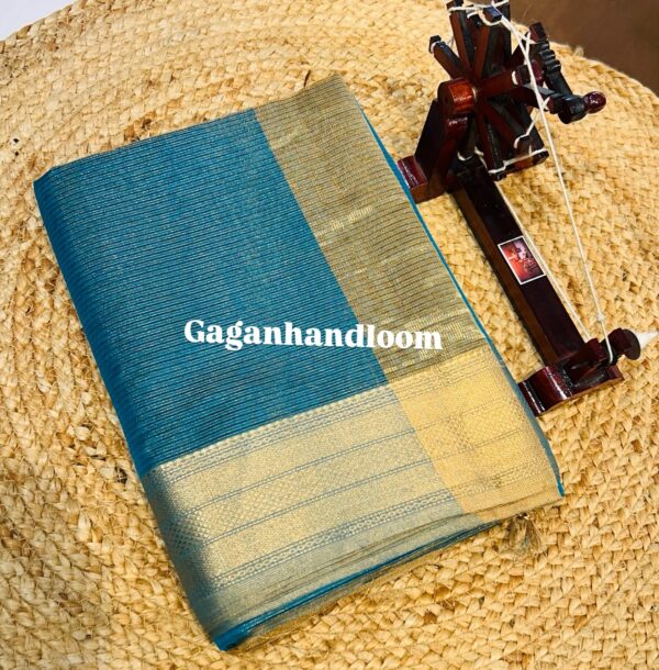 Maheshwari Handloom Tissue Saree with Duble Jari Border The Maheshwari Handloom Tissue Saree is a true symbol of sophistication and royal charm. Handwoven with a unique blend of silk yarns and metallic tissue threads, this saree reflects a subtle sheen that makes it stand apart. Its highlight is the exquisite Diamond Zari Border, meticulously woven with Surat’s fine tested zari, adding grandeur to the soft shimmer of tissue fabric. The saree drapes gracefully, offering a rich yet lightweight feel – making it a favorite for brides, festive wear, and timeless heirloom collections. Crafted in the heritage town of Maheshwar, every saree carries the authenticity of 300 years of weaving tradition initiated by Rajmata Ahilyabai Holkar.