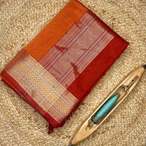 This Maheshwari Jari Border Buti Saree is a timeless handloom creation from Maheshwar, Madhya Pradesh. Woven in a premium silk-cotton blend, the saree offers a perfect balance of comfort, sheen, and graceful drape.