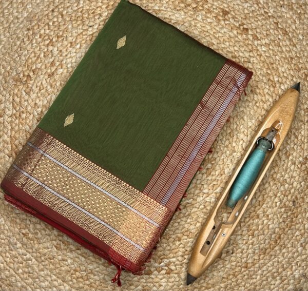 This Maheshwari Jari Border Buti Saree is a timeless handloom creation from Maheshwar, Madhya Pradesh. Woven in a premium silk-cotton blend, the saree offers a perfect balance of comfort, sheen, and graceful drape.